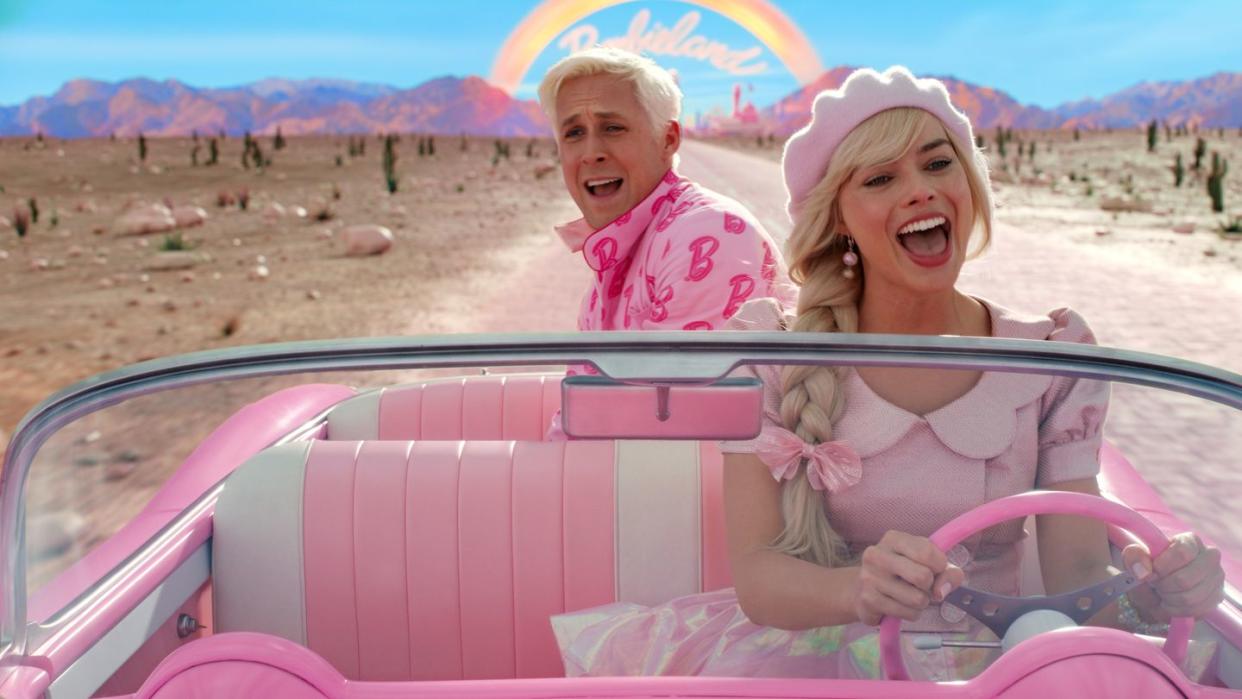 barbie and ken in convertible from the barbie movie