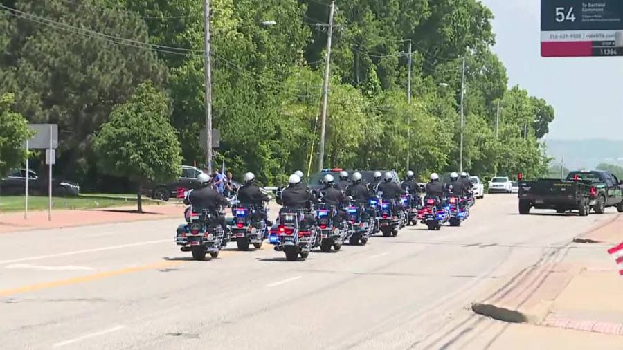 Officers lead Jacob Derbin funeral procession.