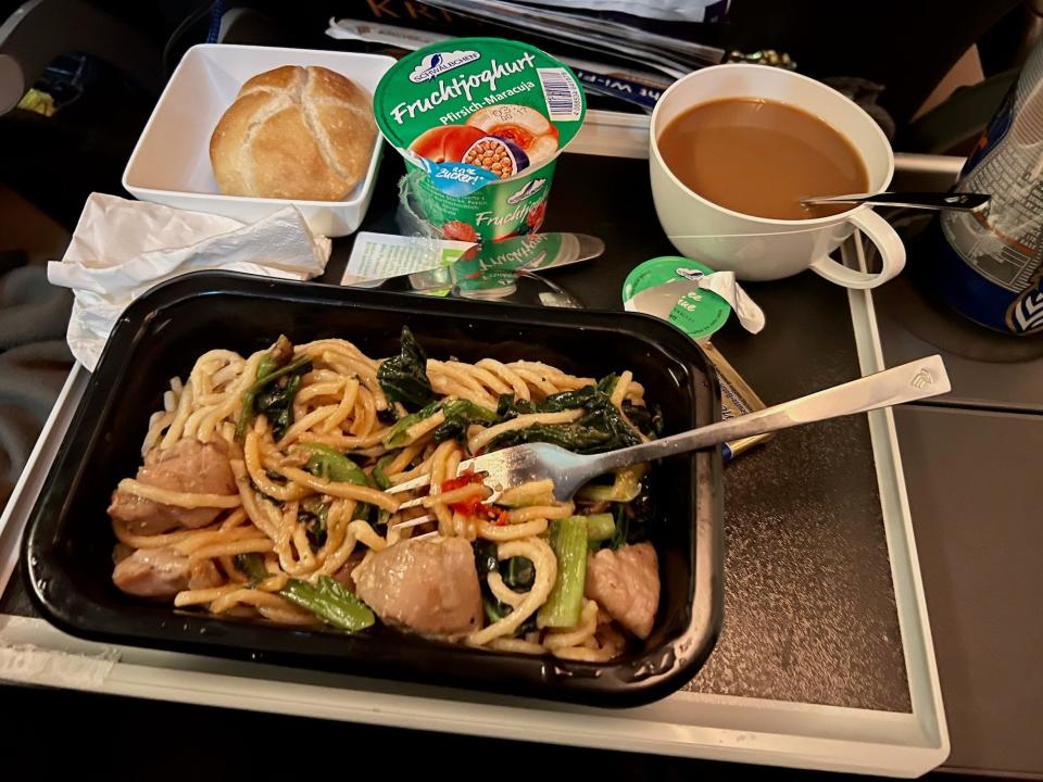 My second meal — noodles, chicken, leaks, coffee, yogurt, and bread.