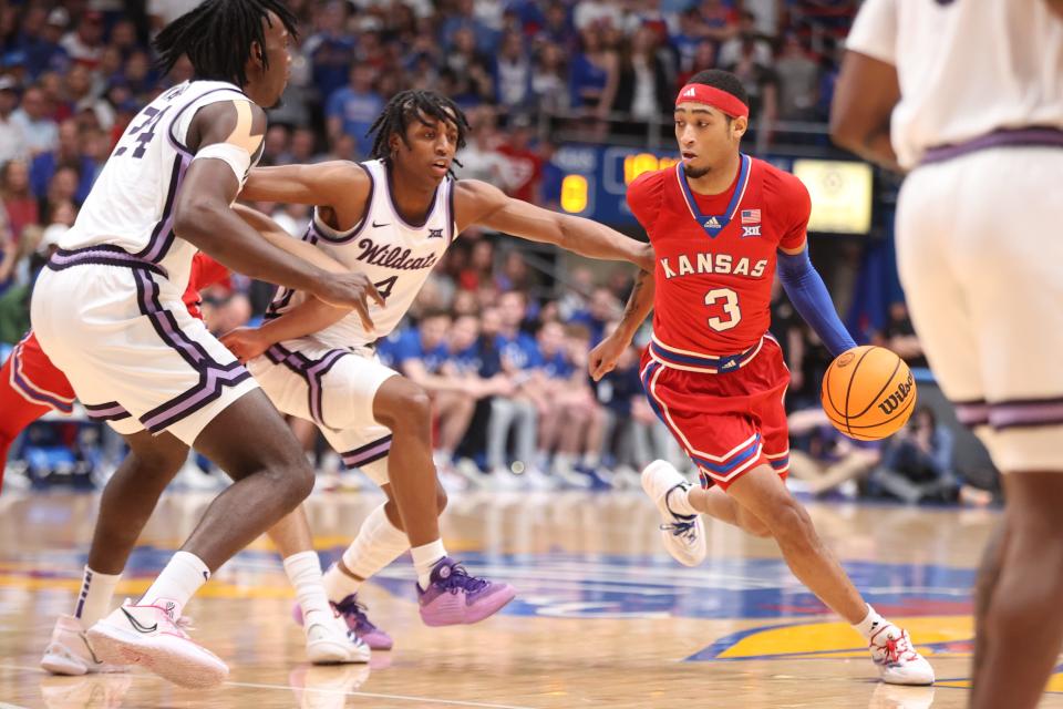 Kansas guard Dajuan Harris Jr. (3) drives the ball against Kansas State during the first half of the Sunflower Showdown game at Allen Fieldhouse on March 5, 2024.