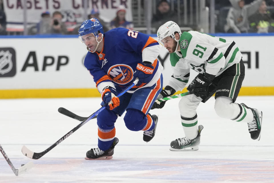 New York Islanders center Kyle Palmieri (21) skates against Dallas Stars center Tyler Seguin (91) during the second period of an NHL hockey game Sunday, Jan. 21, 2024, in Elmont, N.Y. (AP Photo/Mary Altaffer)