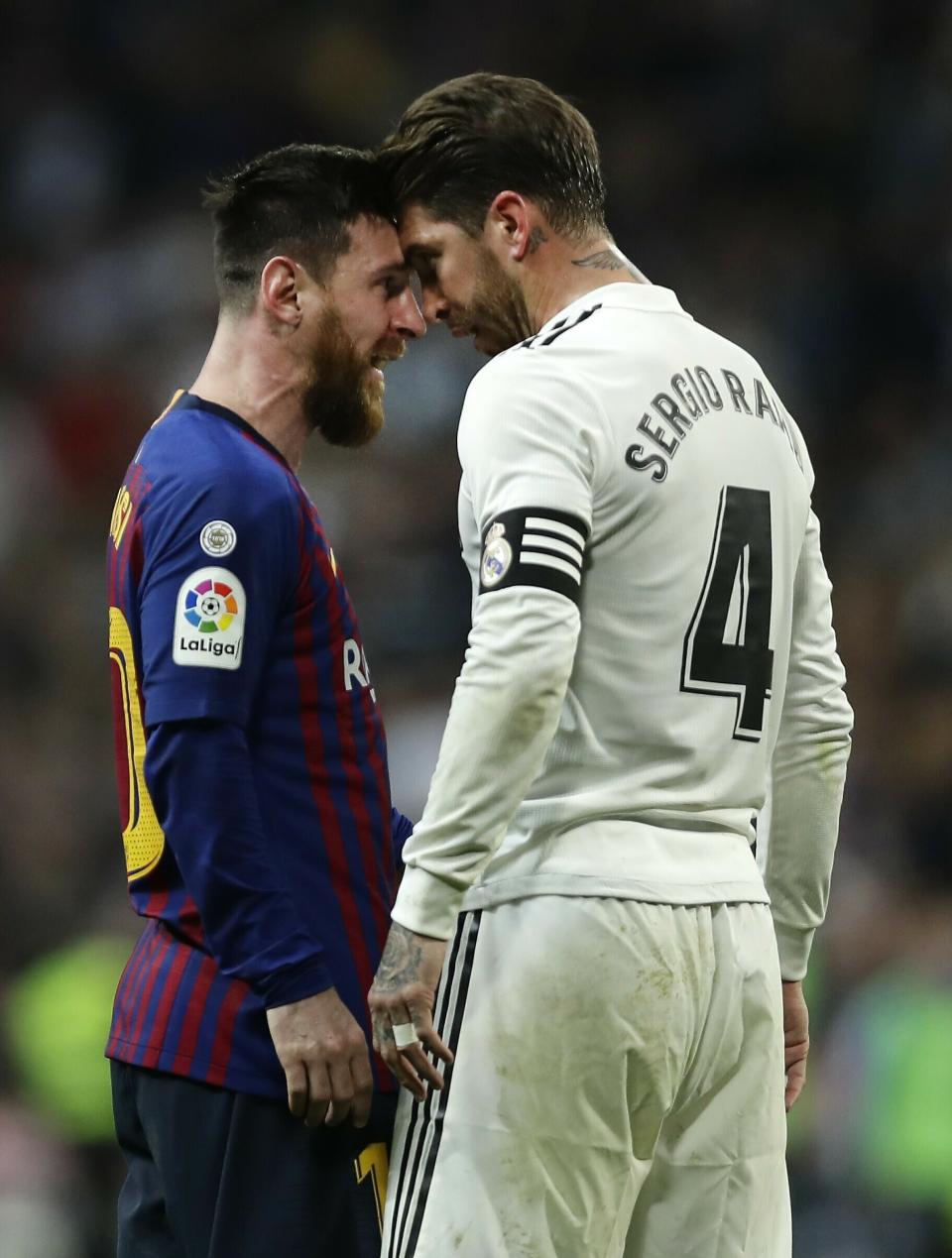 Barcelona forward Lionel Messi, left, goes head to head with Real defender Sergio Ramos after they argue during the Spanish La Liga soccer match between Real Madrid and FC Barcelona at the Bernabeu stadium in Madrid, Saturday, March 2, 2019. (AP Photo/Manu Fernandez)