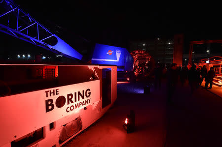 Electric locomotives and tunnel boring equipment are displayed before an unveiling event for the Boring Co. Hawthorne test tunnel in Hawthorne, California, U.S.,December 18, 2018. Robyn Beck/Pool via REUTERS