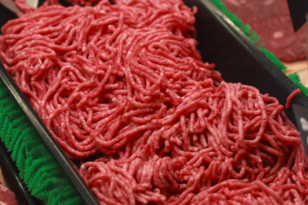 Ground beef is displayed for sale at a market.