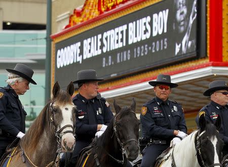 Police on horseback look on as B.B. King's procession heads down Beale Street in Memphis, Tennessee May 27, 2015. REUTERS/Mike Blake