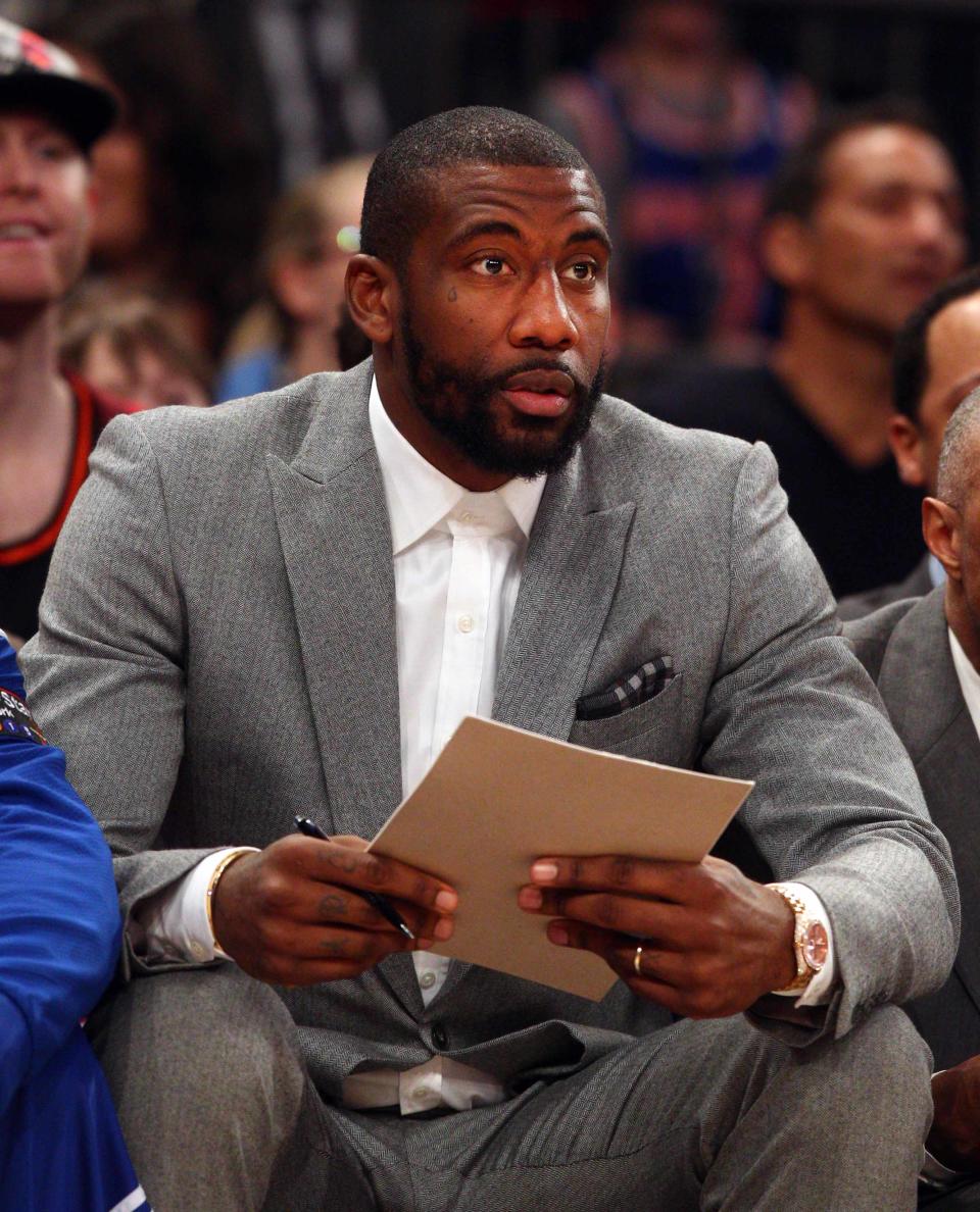 Amar'e Stoudemire watches from the bench during game between the New York Knicks and Milwaukee Bucks at Madison Square Garden in 2015.