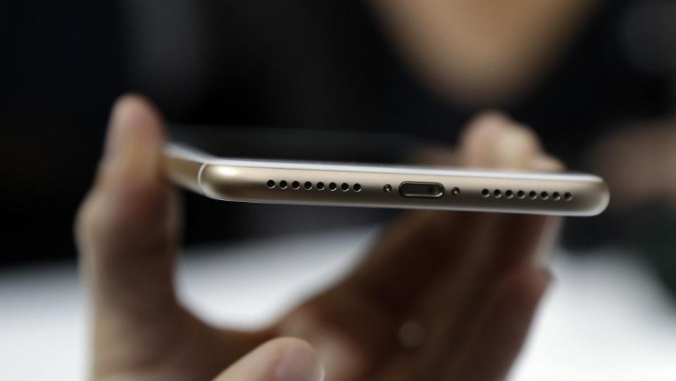 In this Wednesday, Sept. 7, 2016, photo, the lightning port of an iPhone 7 is shown during an event to announce new Apple products, in San Francisco. The new iPhones are better, even when considering that the most dramatic change is what got taken away: the traditional headphone jack. Without a traditional headphone jack, wired headphones plug into the Lightning port normally used for charging. (AP Photo/Marcio Jose Sanchez)