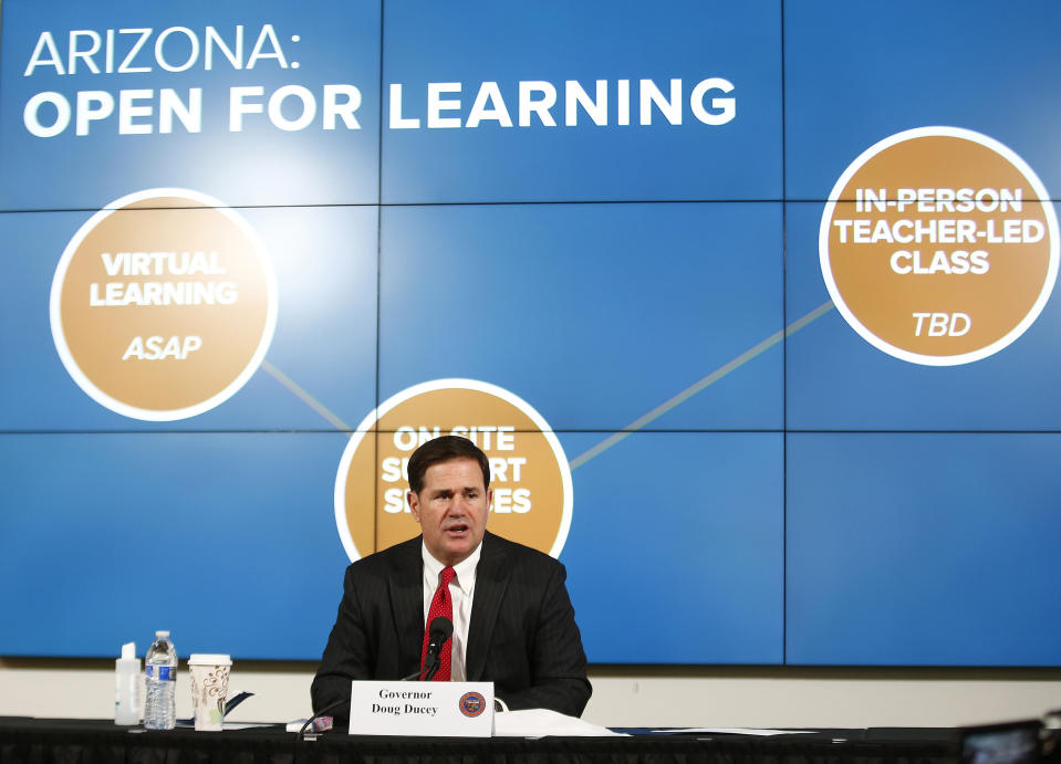 Gov. Doug Ducey talks about schools in Arizona and reopening for the fall semester during press conference on COVID-19 in the state at the Arizona Commerce Authority Conference Center in Phoenix on Thursday, July 30, 2020. (Patrick Breen/The Arizona Republic via AP, Pool)