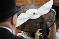 Racegoers arrive on the second day of the annual Royal Ascot horse race meeting in Ascot, England, Wednesday, June 19, 2019. (AP Photo/Alastair Grant)