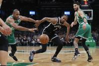 Brooklyn Nets' Kevin Durant, center, vies for the ball with Boston Celtics' Al Horford (42) and Jayson Tatum (0) during the first half of Game 2 of an NBA basketball first-round Eastern Conference playoff series, Wednesday, April 20, 2022, in Boston. (AP Photo/Michael Dwyer)