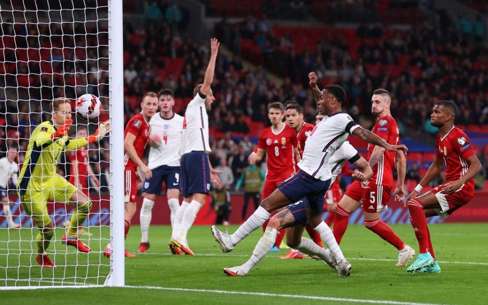 John Stones, hidden behind Raheem Sterling, scores for England  (Getty)