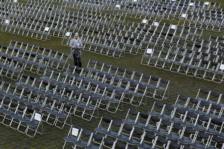 A policeman stands guard next to empty seats before the National Day celebrations in Taipei, Taiwan October 10, 2018. REUTERS/Tyrone Siu