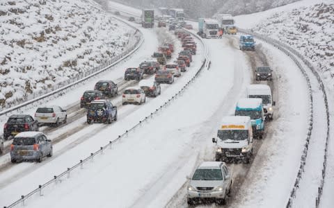 . Lorries and cars queue and ssome tart to get stuck in the snow on the A417 outside Cirencester, Gloucestershire - Credit: Stephen Shepherd/LNP 