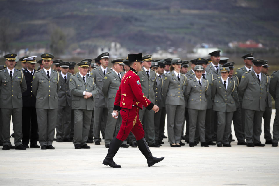 Military officers attend an inauguration ceremony at an airbase, in Kocuve, about 85 kilometers (52 miles) south of Tirana, Albania, Monday, March 4, 2024. NATO member Albania inaugurated an international tactic air base on Monday, the Alliance’s first one in the Western Balkan region. (AP Photo/Armando Babani)