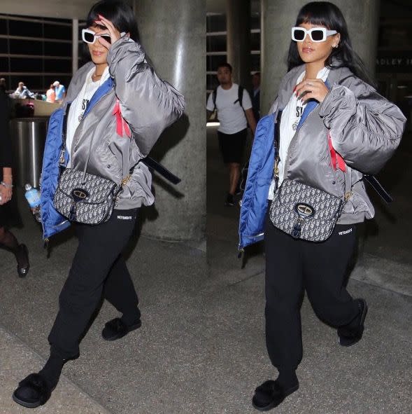 <p>In a grey puffy coat, white sunglasses, sweatpants, socks, and sandals at LAX after her trip to Japan. </p>