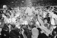 FILE - In this Dec. 18, 1983, file photo, University of Tennessee coach Johnny Majors rides victorious on the shoulders of his team after Tennessee defeated Maryland 30-23 at the Citrus Bowl in Orlando, Fla. Majors, the coach of Pittsburgh’s 1976 national championship team and a former coach and star player at Tennessee, has died. He was 85. Majors died Wednesday morning, June 3, 2020, at home in Knoxville, Tenn., according to a statement from his wife, Mary Lynn Majors. (AP Photo/Kirk McKoy, File)