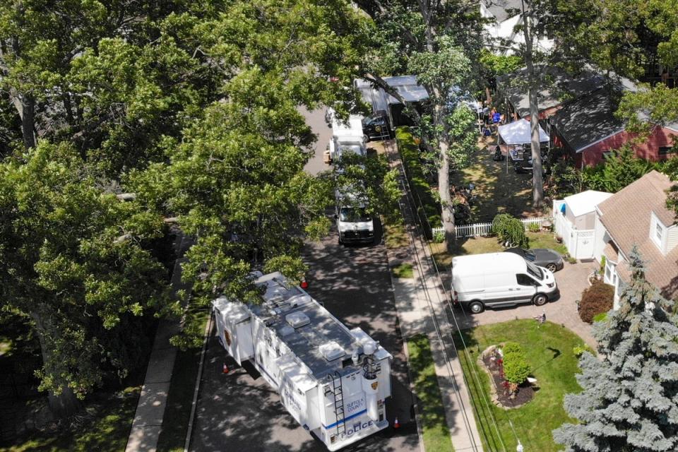 Authorities searching the home of suspect Rex Heuerman (Copyright 2023 The Associated Press. All rights reserved.)