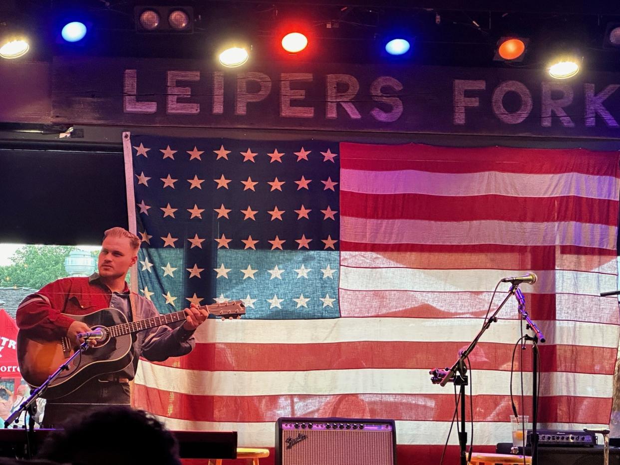 While the real Zach Bryan didn't show up at Fox & Locke's "Great American Bar Scene" preview party Thursday night, his cardboard cutout took his spot on the stage at the Leiper's Fork restaurant and bar that was chosen by Bryan to be one of 23 bars that got to preview his new record.