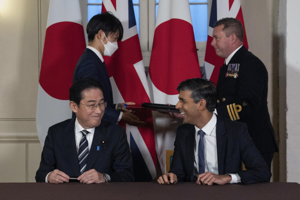 Britain's Prime Minister Rishi Sunak, foreground right, smiles next to Japan's Prime Minister Fumio Kishida after they signed a defense agreement during a bilateral meeting at the Tower of London, Wednesday, Jan. 11, 2023. The leaders of Britain and Japan are signing a defense agreement on Wednesday that could see troops deployed to each others’ countries. (Carl Court/Pool Photo via AP, File)