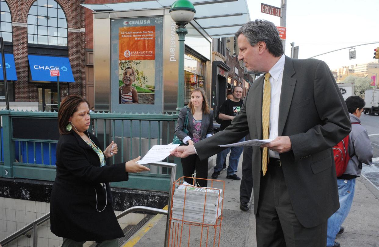 NYC Public Advocate Bill De Blasio hands out flyers at the Christopher Street subway station alerting commuters to "Help Keep Our Subways Safe" and tell the MTA and State Leaders to stop cutting station agents and start fixing over 2,000 broken station security cameras on April 5, 2010.