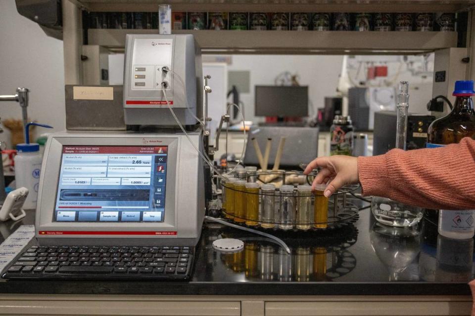 Michelle Williams, microbiologist at Boulevard Brewing, measures the alcohol content of a beer sample inside the laboratory at Boulevard.