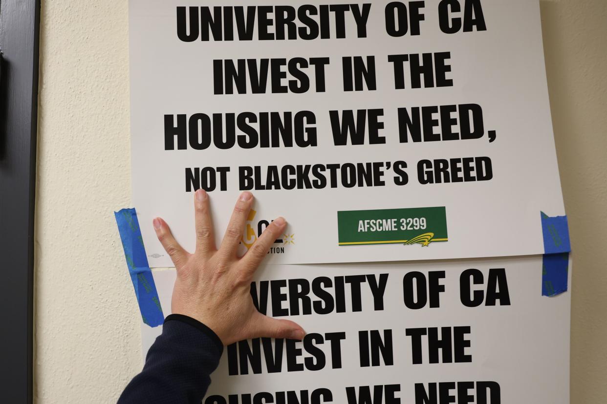 A sign is placed in the hallways outside of the Chancellors office during a protest calling for the UC Retirement Plan to divest from Blackstone at UCLA on Wednesday, Feb. 14, 2024 in Los Angeles, CA.