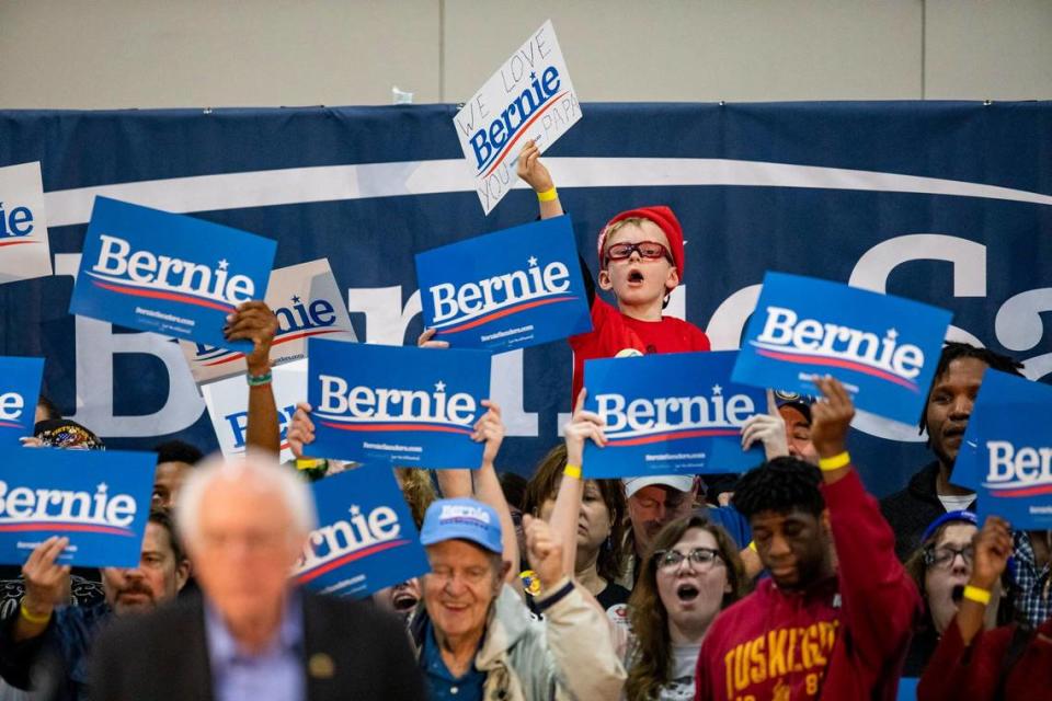 Bernie Sanders supporters hold campaign signs as the Democratic presidential candidate speaks during a rally at the Myrtle Beach Convention Center Wednesday afternoon in Myrtle Beach.