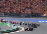 Red Bull driver Max Verstappen of the Netherlands leads at the start and followed by Mercedes driver Lewis Hamilton of Britain and Mercedes driver Valtteri Bottas of Finland during the Formula One Dutch Grand Prix, at the Zandvoort racetrack, Netherlands, Sunday, Sept. 5, 2021. (AP Photo/Peter Dejong)