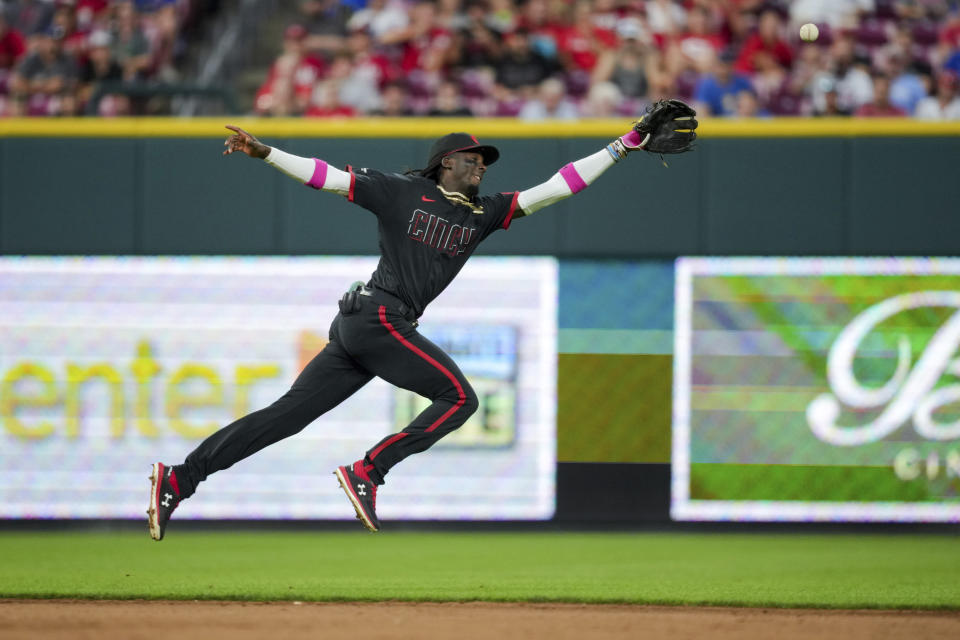 Cincinnati Reds' Elly De La Cruz is unable to field a ball hit by Chicago Cubs' Ian Happ for an RBI single during the fifth inning of the second game of a baseball doubleheader in Cincinnati, Friday, Sept. 1, 2023. (AP Photo/Aaron Doster)