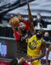Portland Trail Blazers forward Robert Covington, left, shoots over Golden State Warriors forward Draymond Green during the second half of an NBA basketball game in Portland, Ore., Wednesday, March 3, 2021. (AP Photo/Craig Mitchelldyer)
