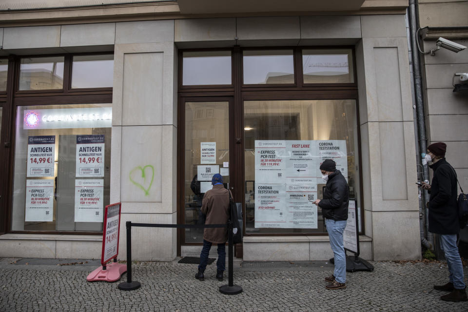 BERLIN, GERMANY - NOVEMBER 15: People line up at a Covid-19 testing station on November 15, 2021 in Berlin, Germany. Starting today only people who are vaccinated against or recently recovered from Covid-19 are allowed to enter many public venues, including restaurants, bars, cinemas, fitness studios, clubs and hair salons. Critics say the 