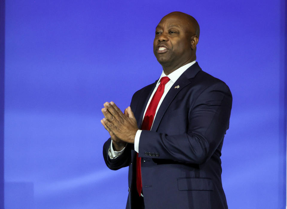 Sen. Tim Scott of South Carolina, a Republican presidential candidate, gestures to attendees as he arrives at the Republican Jewish Coalition's Annual Leadership Summit at The Venetian Resort Las Vegas on Oct. 28, 2023 in Las Vegas, Nevada.  / Credit: Getty Images