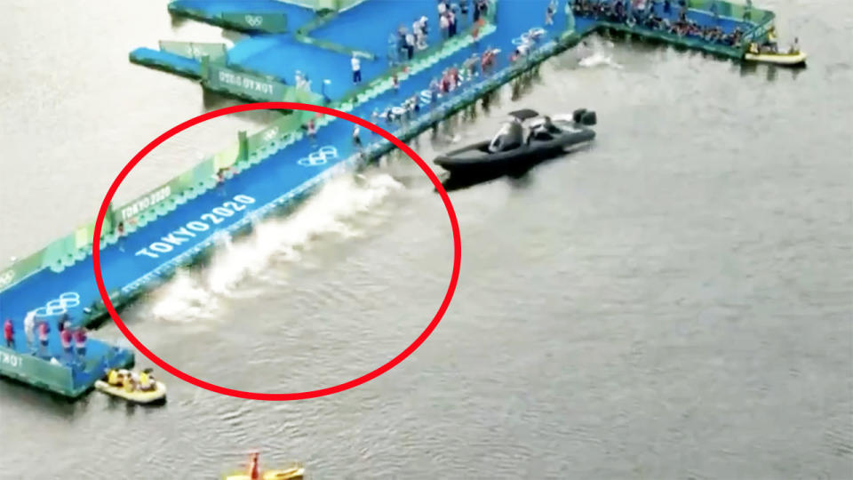 Half the field, pictured here diving into the water as the other half were blocked by a TV boat.