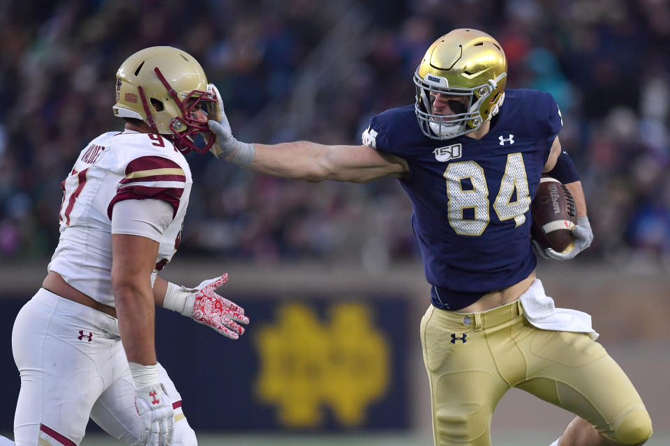 Notre Dame TE Cole Kmet stiff-arms a Boston College defender. (Photo by Robin Alam/Icon Sportswire via Getty Images)