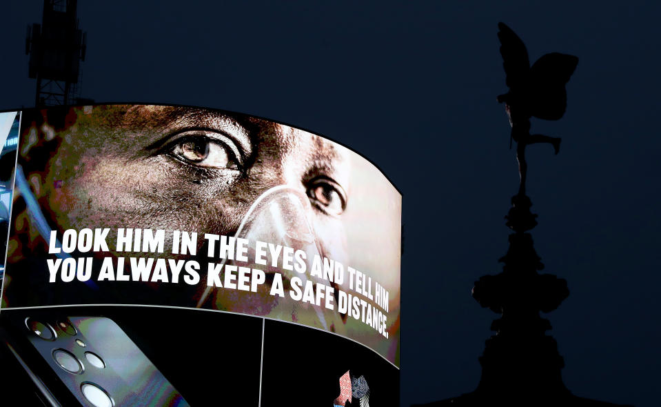 LONDON, ENGLAND - FEBRUARY 03: Covid-19 messaging is seen on the advertising hoarding at Piccadilly Circus during the UK's third national lockdown on February 03, 2021 in London, England . (Photo by Chris Jackson/Getty Images)