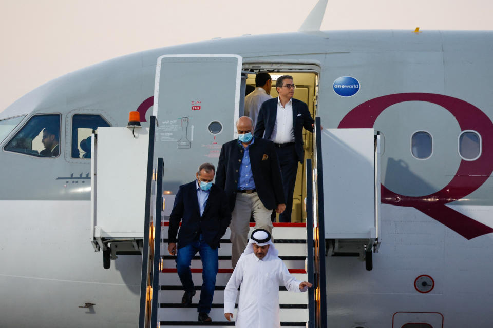 U.S. citizens, from left, Emad Sharqi and Morad Tahbaz Siamak Namazi disembark from a Qatari jet upon their arrival at the Doha International Airport on Sept. 18, 2023. (Karim Jaafar / AFP - Getty Images)
