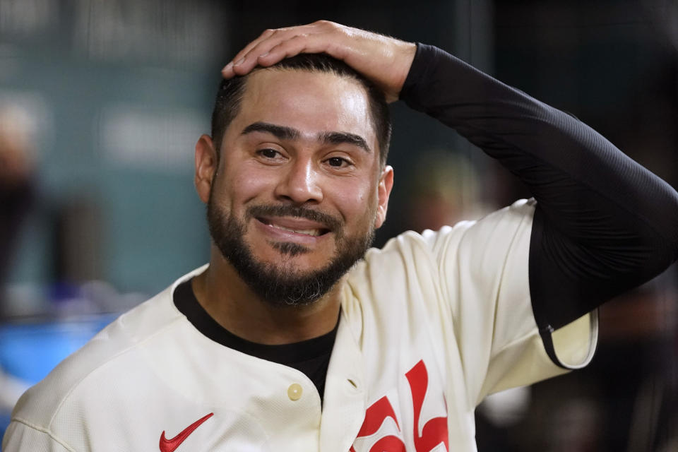 Texas Rangers starting pitcher Martin Perez smiles in the dugout after the seventh inning of a baseball game against the Colorado Rockies in Arlington, Texas, Friday, May 19, 2023. (AP Photo/LM Otero)