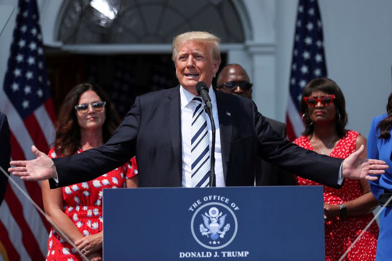 FILE PHOTO: Former U.S. President Donald Trump speaks to media at his golf club in Bedminster, New Jersey