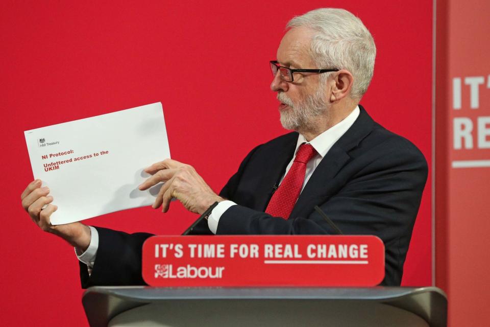 Jeremy Corbyn brandishing the report this morning (PA)