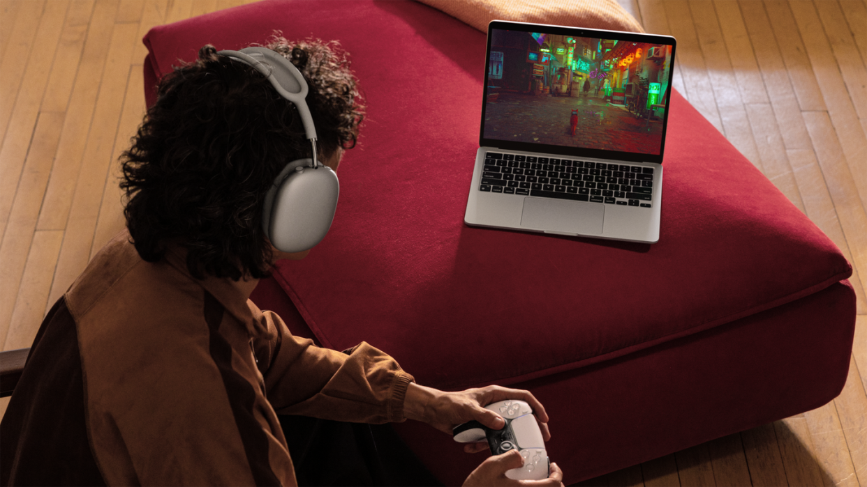 a person playing the game stray on the macbook air with m3 processor
