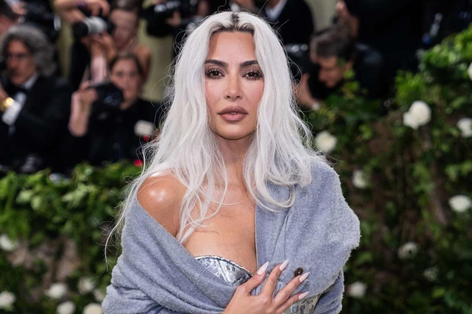 <p>Gotham/Getty Images</p> Kim Kardashian steps out with blonde hair at the 2024 Met Gala