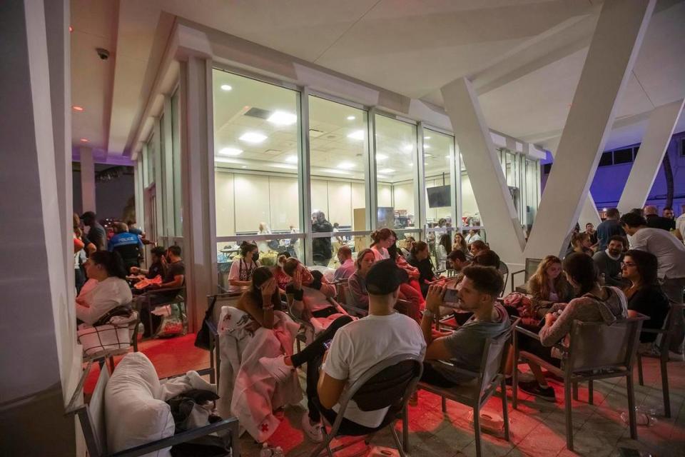 Family and friends wait for for updates at a reunification center at 9301 Collins Ave in Surfside during the search-and-rescue operation after the partial collapse of the Champlain Towers South in Surfside on Thursday June 24th., 2021.