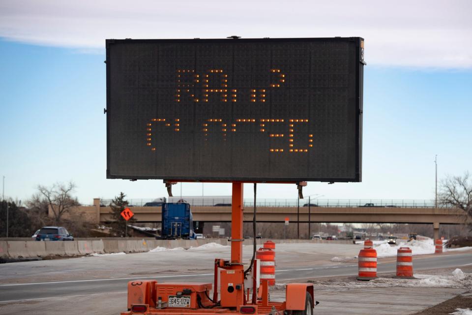 A traffic sign flashes road closure information near the Interstate 25 Harmony Road exit on Tuesday in Fort Collins.