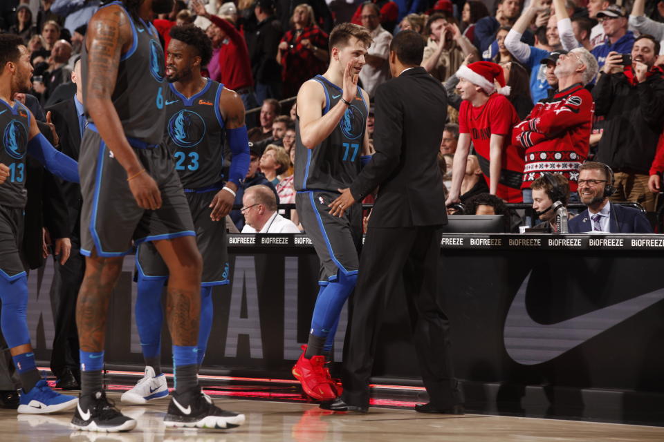 Mavericks rookie Luka Doncic celebrates after hitting a game-tying three at the end of regulation. (Photo by Cameron Browne/NBAE via Getty Images)