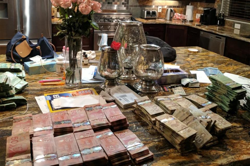 Cash on Gerald Cotten’s kitchen counter, from a report on Quadriga by Ontario Securities Commission (Ontario Securities Commission)