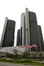 Flags fly in front of General Motors world headquarters at the Renaissance Center on June 1, 2009 in Detroit, Michigan. (Photo by Michael Heiman/Getty Images)