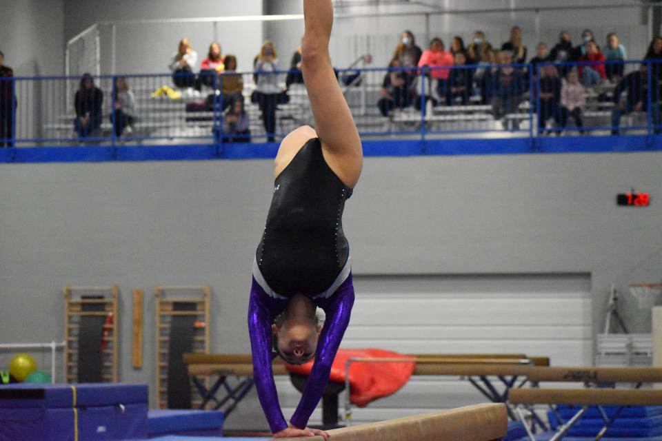 Bloomington South's Madeline Kawanishi performs on the beam during regionals at The Gymnastics Company on March 4, 2022.