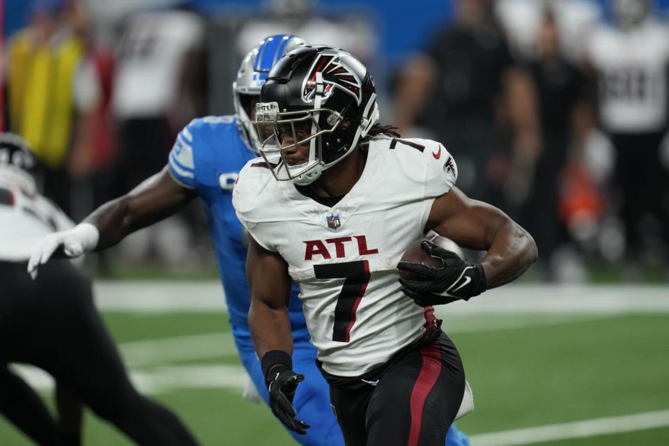 Atlanta Falcons running back Bijan Robinson runs the ball against the Detroit Lions.