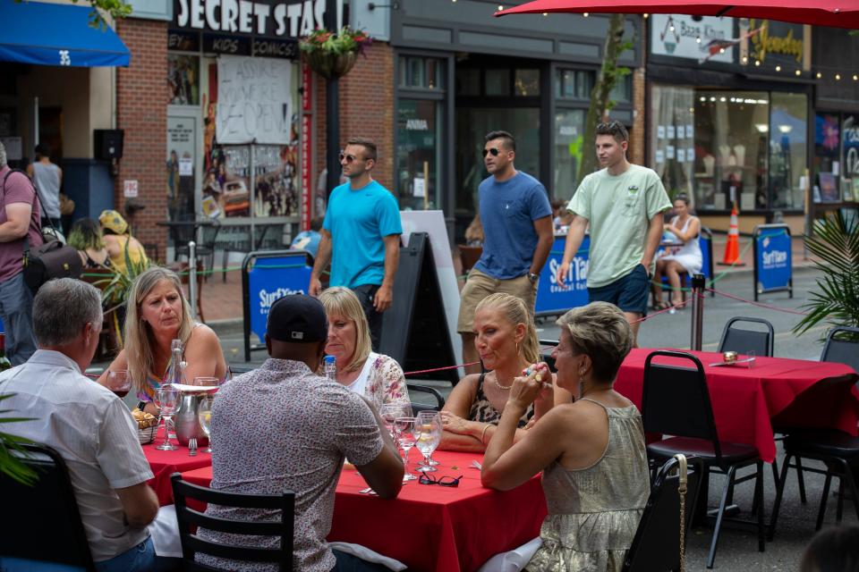 Diners enjoy meals on Red Bank's Broadwalk area in 2020.