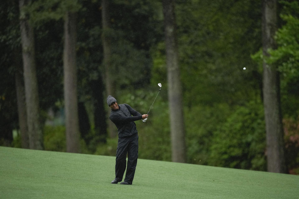 Tiger Woods chips to the green on the 13th hole during the weather delayed third round of the Masters golf tournament at Augusta National Golf Club on Saturday, April 8, 2023, in Augusta, Ga. (AP Photo/Matt Slocum)